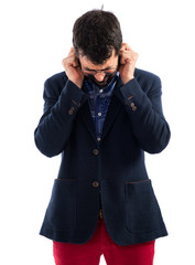 Vintage young man covering his ears