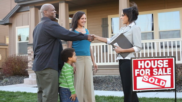 Happy African American family buy a house 