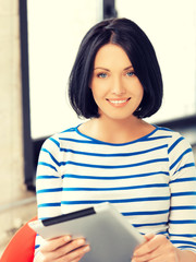 happy teenage girl with tablet pc computer