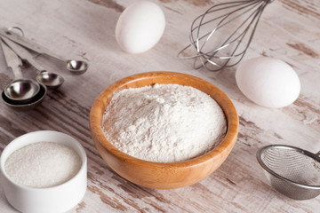 ingredients and tools to make a cake, flour, sugar,eggs