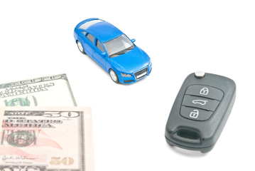 blue car, black car keys and dollar notes