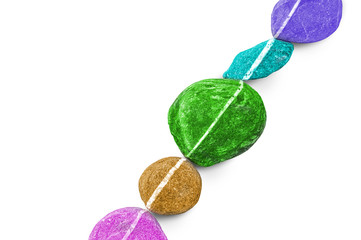 Diagonal line of colorful stones, isolated on white background