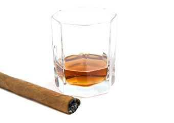cigar and glass of cognac on white