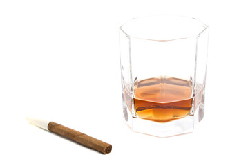 cigarillo and glass of cognac on white