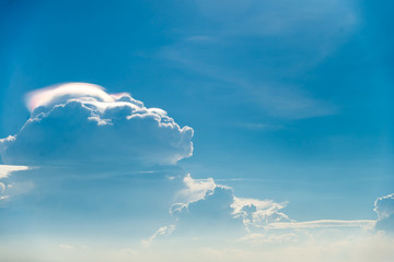 Naklejka na ściany i meble Rain bow cloud with blue sky on sunny day
