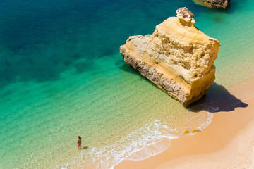 Girl relaxing at the Beautiful Beach in Algarve, Portugal