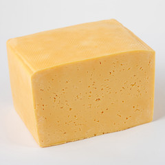 block of cheese on a white background