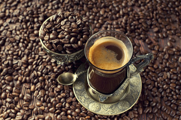 Cup of coffee and coffee grains