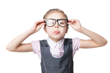 Funny little girl in glasses makes faces