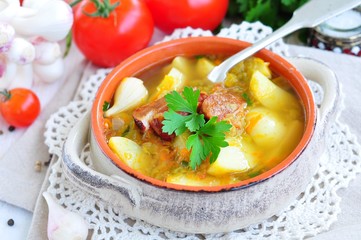 fresh vegetables, tomatoes, garlic, potatoes and parsley with smoked pork ribs