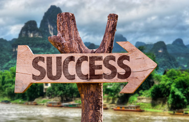 Success direction sign with exotic background