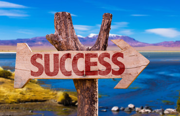 Success direction sign with landscape background