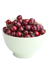 Sweet cherries in a bowl isolated