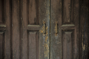 Old wooden door with padlock