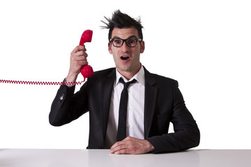 Naklejka premium surprised businessman with red phone