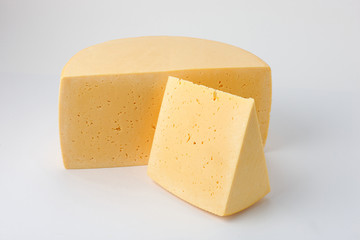 half and a segment of cheese on a white background