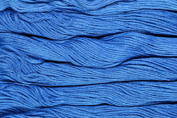 Blue skeins of floss as background texture