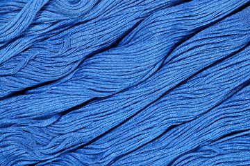 Blue skeins of floss as background texture