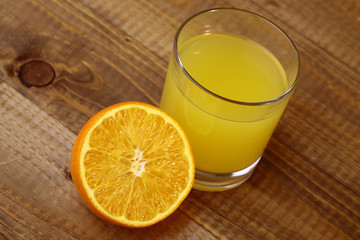 Orange fruit and glass of juice