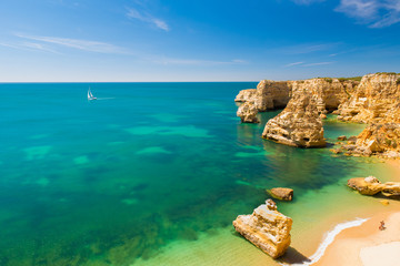 Fototapeta premium Beautiful Beach at the coast of Algarve, Portugal