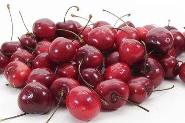 Fresh cherries on white
