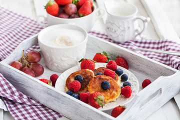 Cheese pancakes with fresh berries