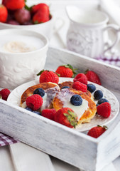 Cheese pancakes with fresh berries