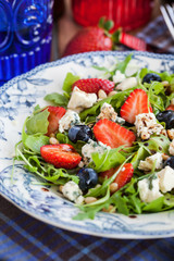 Arugula, strawberry, blueberry and blue cheese salad