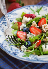 Arugula, strawberry, blueberry and blue cheese salad