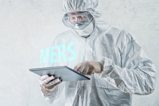 Medical Scientist Reading About MERS Virus on Figital Tablet Com