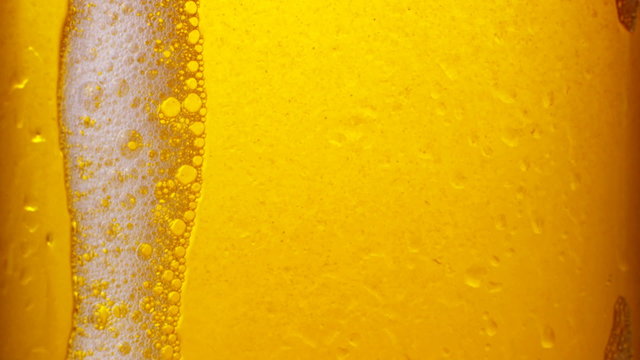 Glass of beer with bubbles