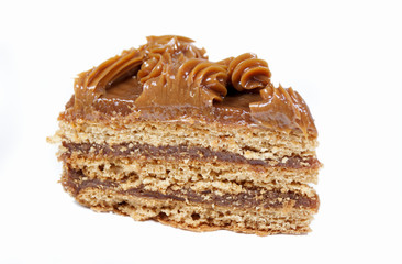 Piece of cake with honey shortcakes, cream boiled condensed milk