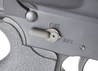 Safety engaged on a modern sporting rifle isolated on a white background