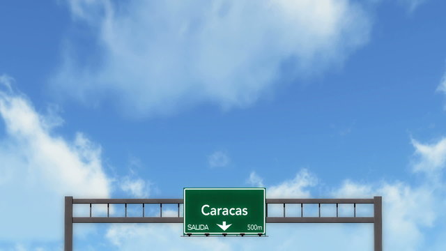Passing under Caracas Venezuela Highway Road Sign
  