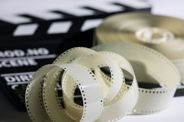 Closeup of a spool of film into a movie clapper and for film pro