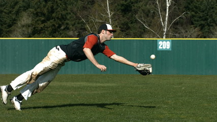 Baseball player catching ball, slow motion