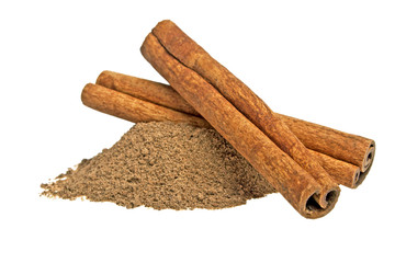 Cinnamon sticks and powder on white background