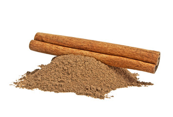 Cinnamon stick and powder on white background