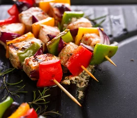 Fotobehang Grill / Barbecue Grilled skewers of salmon and vegetables