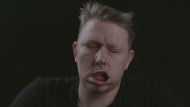 Man's face is blown in wind