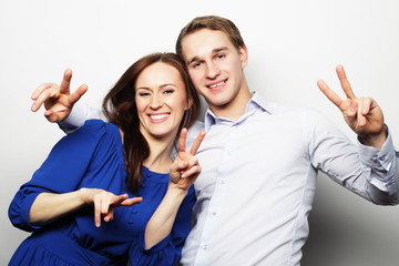  lovely couple with thumbs-up gesture 