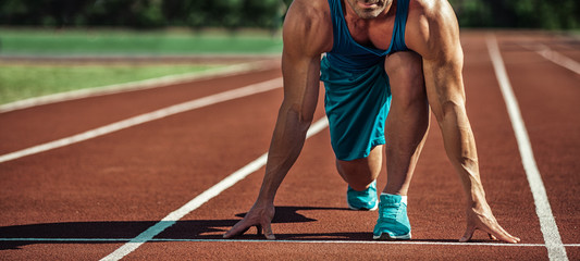 Handsome healthy happy strong athlete male man exercising at the