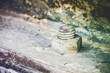 Grunge metal rusty screw and bolt background.