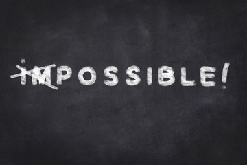 everything is possible - motivation text on chalkboard