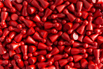 Unicolored background pattern made from red gamefigurines
