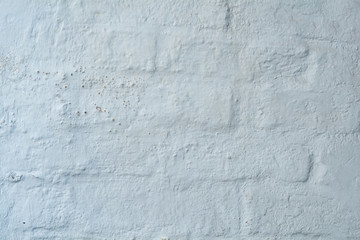 Background texture, white plaster on an old brickwall