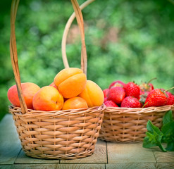Fresh organic apricots and  strawberries