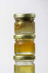 Three jars of honey of differents flavors