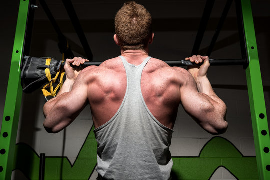 Strong male at a gym - Powered by Adobe