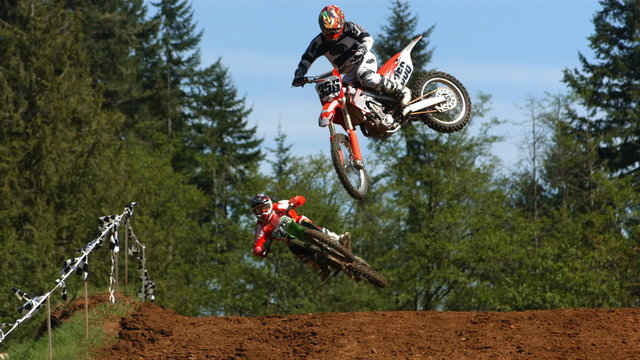 Motorcross racers jumping 